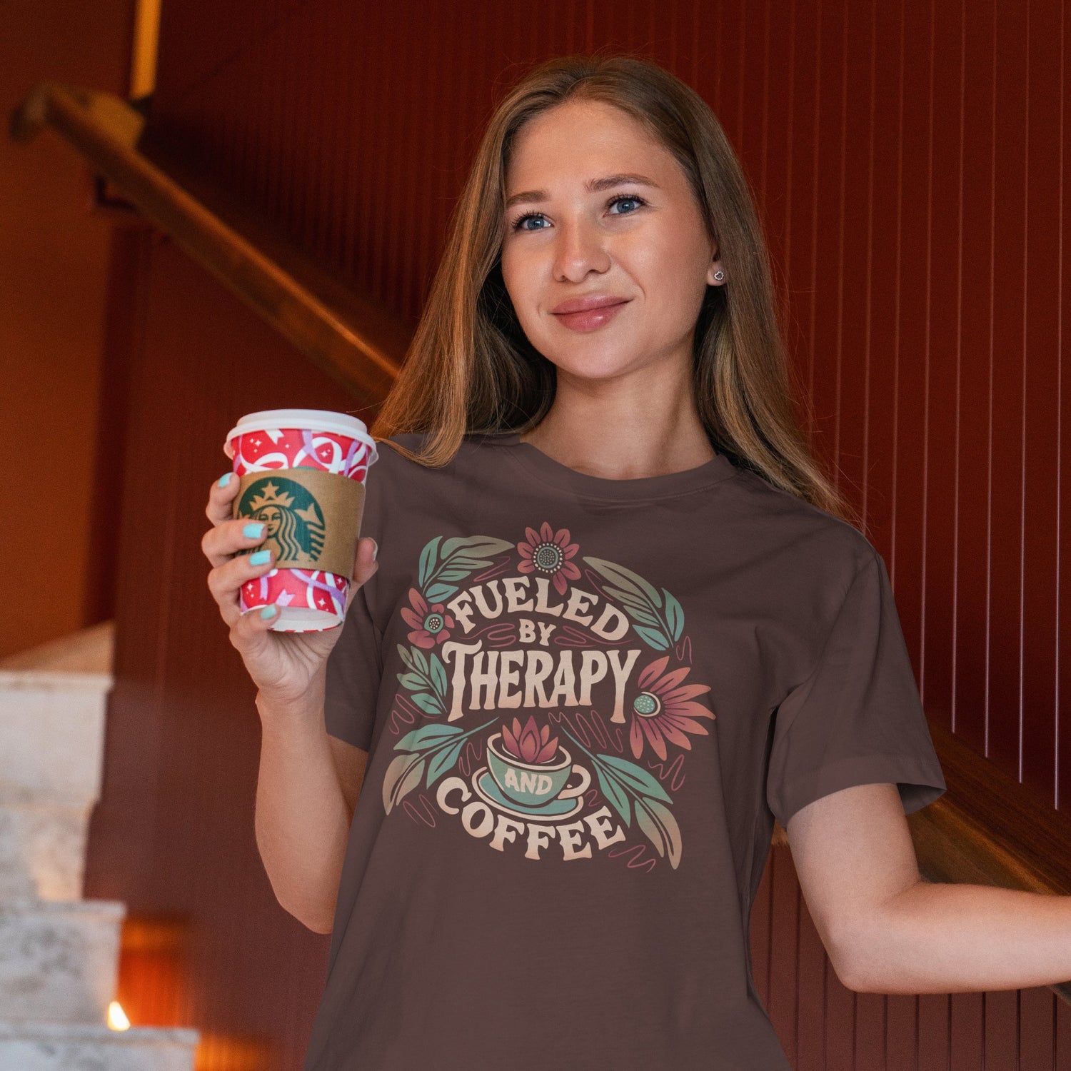 Woman wearing mental health shirt, holding a coffee cup