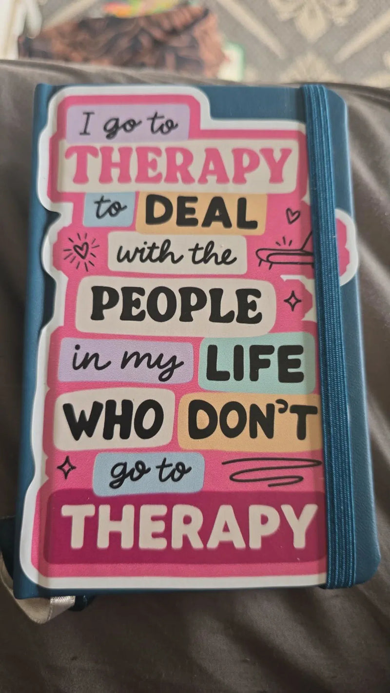 I Go to Therapy sticker on a therapy journal