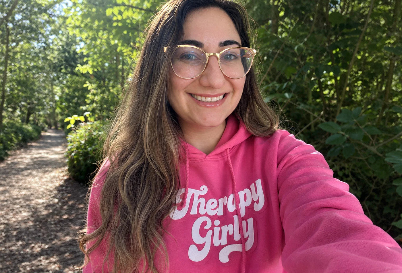 Alyssa Ostroff, founder of Self-Care Shirts, wearing her hand-drawn Therapy Girly hoodie